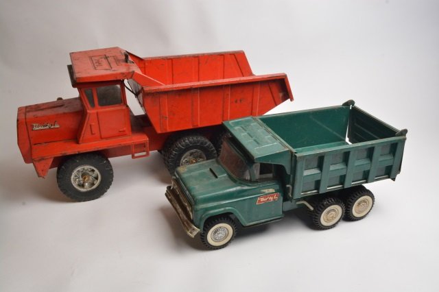 (2) Pressed Steel Buddy L Hydraulic Dump Trucks: Buddy L 20" pressed steel dump truck children's toy. Original Buddy L embossed rubber tires. Hydraulic works. Frame on back of window cab is bent. Please refer to photo for condition. Buddy L 15" Hydr