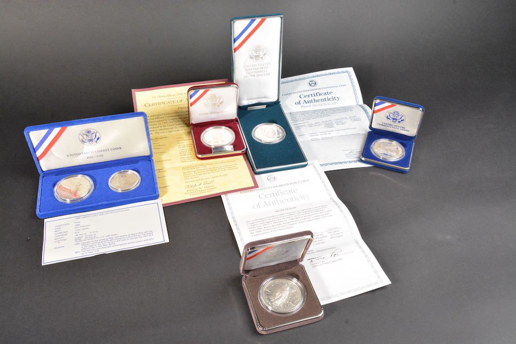 (5) Silver Dollars & (1) Half Silver Dollar: 1987 Silver Dollar, San Francisco mint, COA. US Constitution 200th Anniversary 1787-1987 silver dollar. 1986 Ellis Island silver dollar. 1986 silver half dollar. Thomas Jefferson 250th Anniversary sil