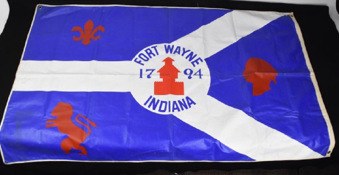 City of Fort Wayne Oil Cloth Flag: City of Fort Wayne oil cloth flage, 58" x 36". Blue background, red fleur-de-lis (represents the French Forts), red Indian Head (representing the Miami Indians), red lion (represents the English Forts