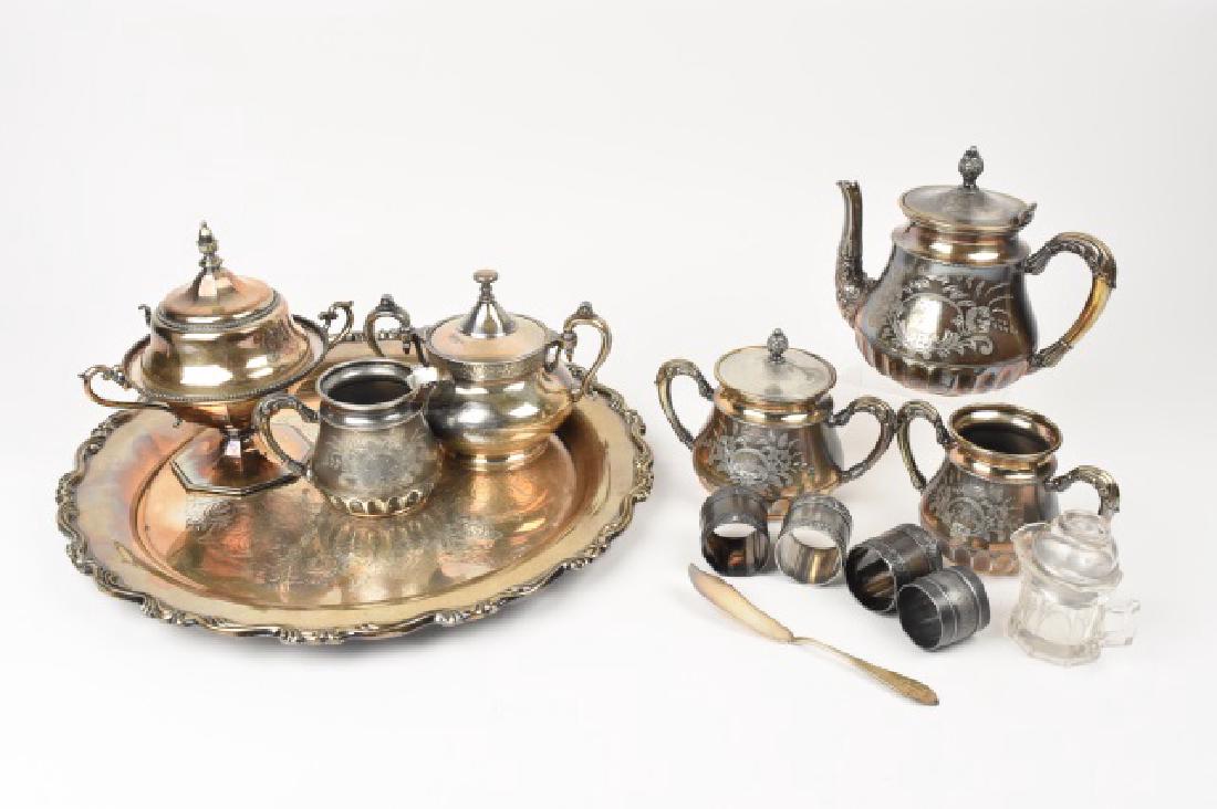 Forbes Silver Co. Quadruple Plate Tea Set & Other: Silver plated tea set, napkin rings and platter. Different makers. Forbes Silver Co. 169 quadruple plate tea pot 5 pc. set. WMA Rogers serving tray, 17" diameter. Reed & Barton 2710 lidded sugar. Derb