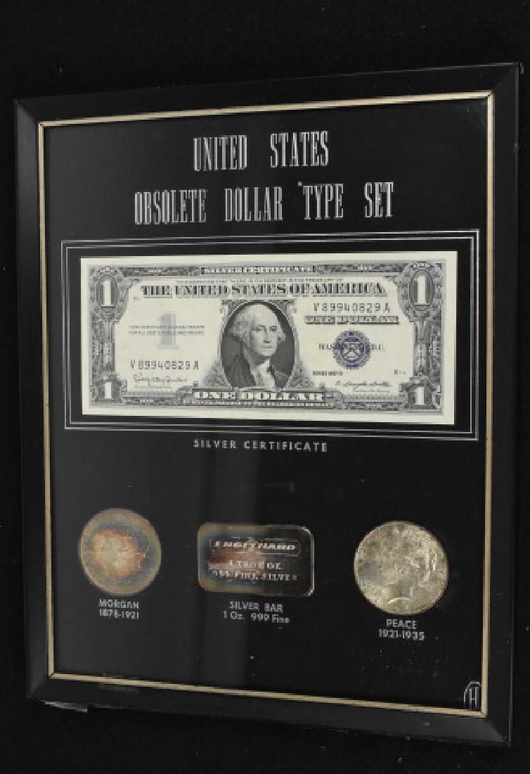 United States Obsolete Dollar Type Set: United States Obsolete Dollar Type Set. 1957 B silver certificate, 1884 Morgan silver dollar, Engelhard 1 troy ounce silver bullion, 1923 Peace silver dollar. Frame measures 8" x 10". Contact our reco
