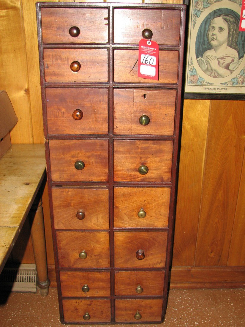 Apothecary Chest: Mahogany 19th century English apothecary chest with 16 drawers having combination of old round wooden and brass pulls, dovetailed construction, 48" x 17 1/2" x 7"
