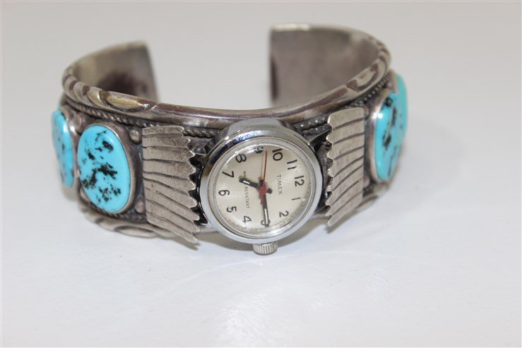 Native American OLD PAWN Watch/Band: sterling silver watch band with timex watch, inset with 8 Turquoise stones_x000D_, SIGNED BY THE ARTIST_x000D_, approx 2 1/2" across _x000D_, 97.1 grams_x000D_