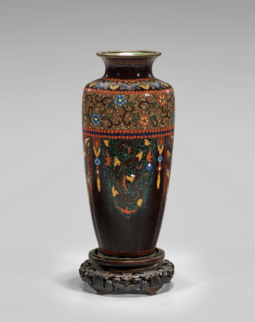 OLD JAPANESE ANDO CLOISONNÉ ENAMEL VASE: Old Japanese Ando cloisonné enamel vase; of ovoid form with flared rim, with multicolor archaistic design of alternating phoenix and hydra lappets and floral borders, showing goldstone accents,