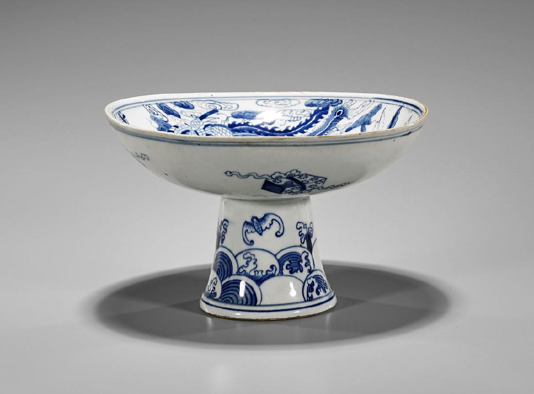 Chinese Blue & White Porcelain Stem Bowl: Chinese blue and white porcelain bowl; with qilin and phoenix to interior, and Buddhist emblems to exterior; waves and bats to flared stem; D: 8 3/4" (approx.)