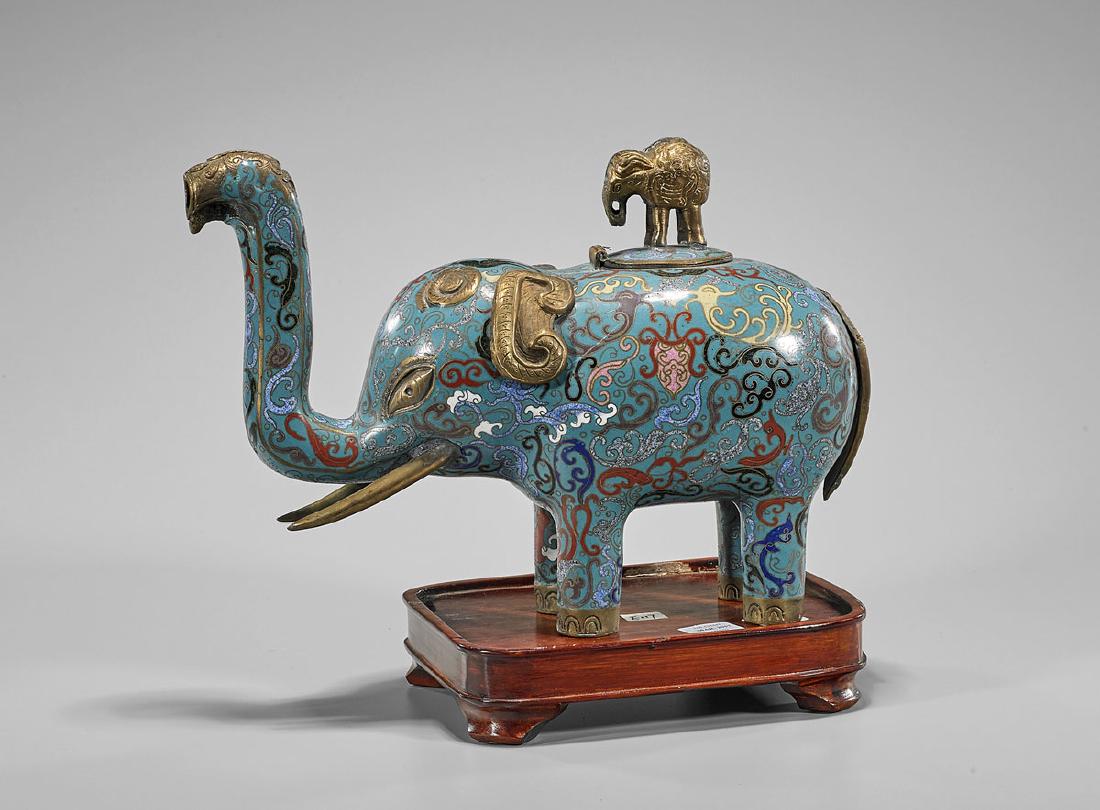 Chinese Cloisonne Enamel Elephant Censer: Chinese cloisonné enamel censer; in the form of an elephant standing foursquare; with elephant finial to hinged cover; Provenance: Collection of Gerald & Christina Sugarman; H: 12"; wood st