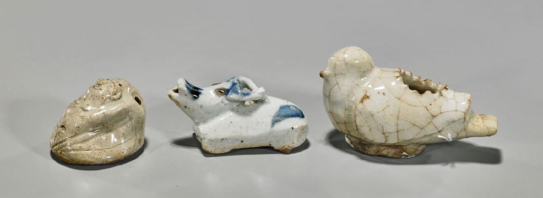 Three Old & Antique Chinese Waterdroppers: Group of three old and antique Chinese glazed pottery waterdroppers, including: blue and white recumbent bull; crackle-glazed recumbent bird with illegible mark to base; together with curved-form show