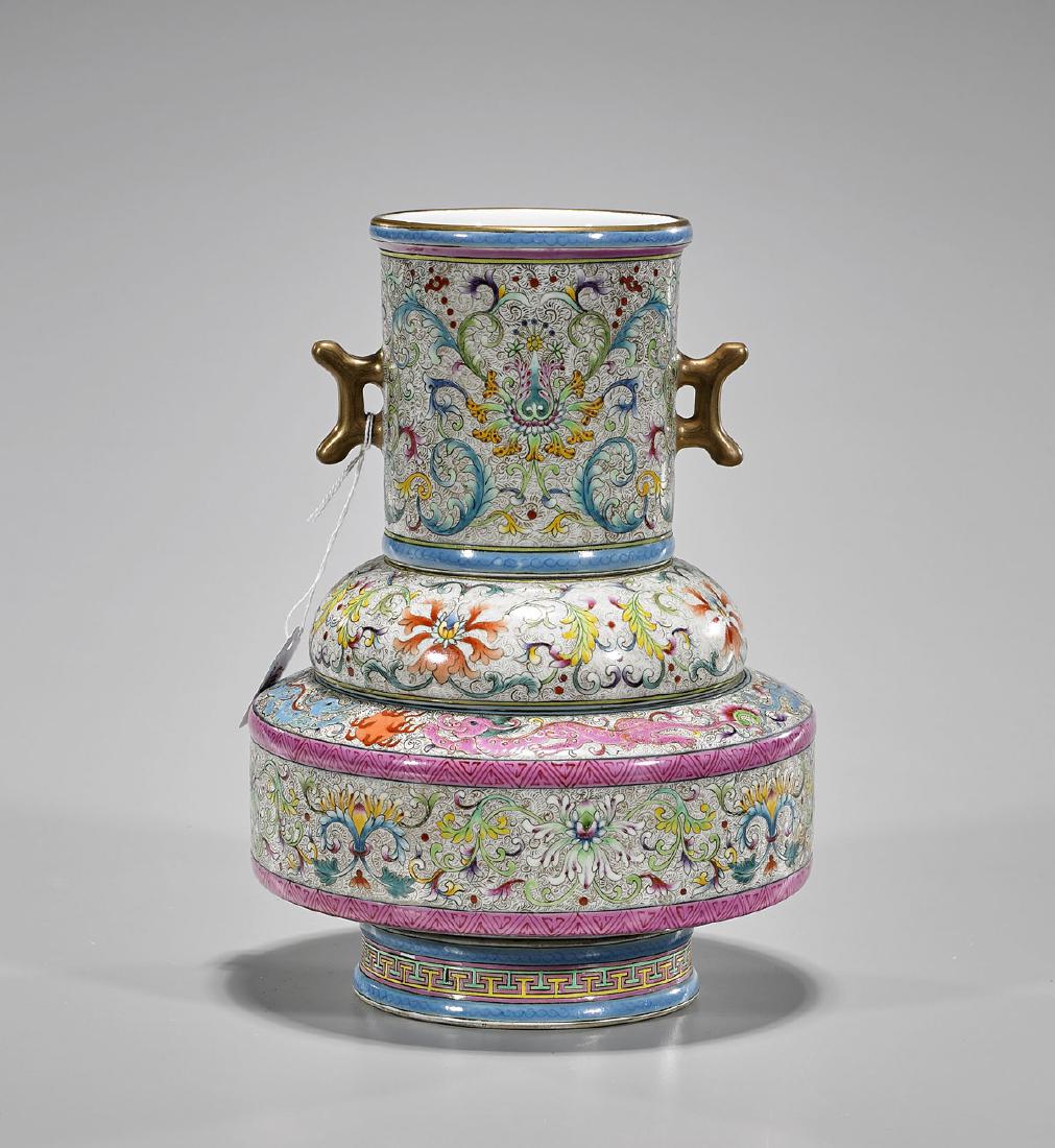 Unusual Chinese Sectional Porcelain Vase: Unusual Chinese sectional porcelain vase, comprised of four pieces, including: three with finely detailed enamel designs of scrolling flora atop cream ground with gilt linear patterning, the uppermost