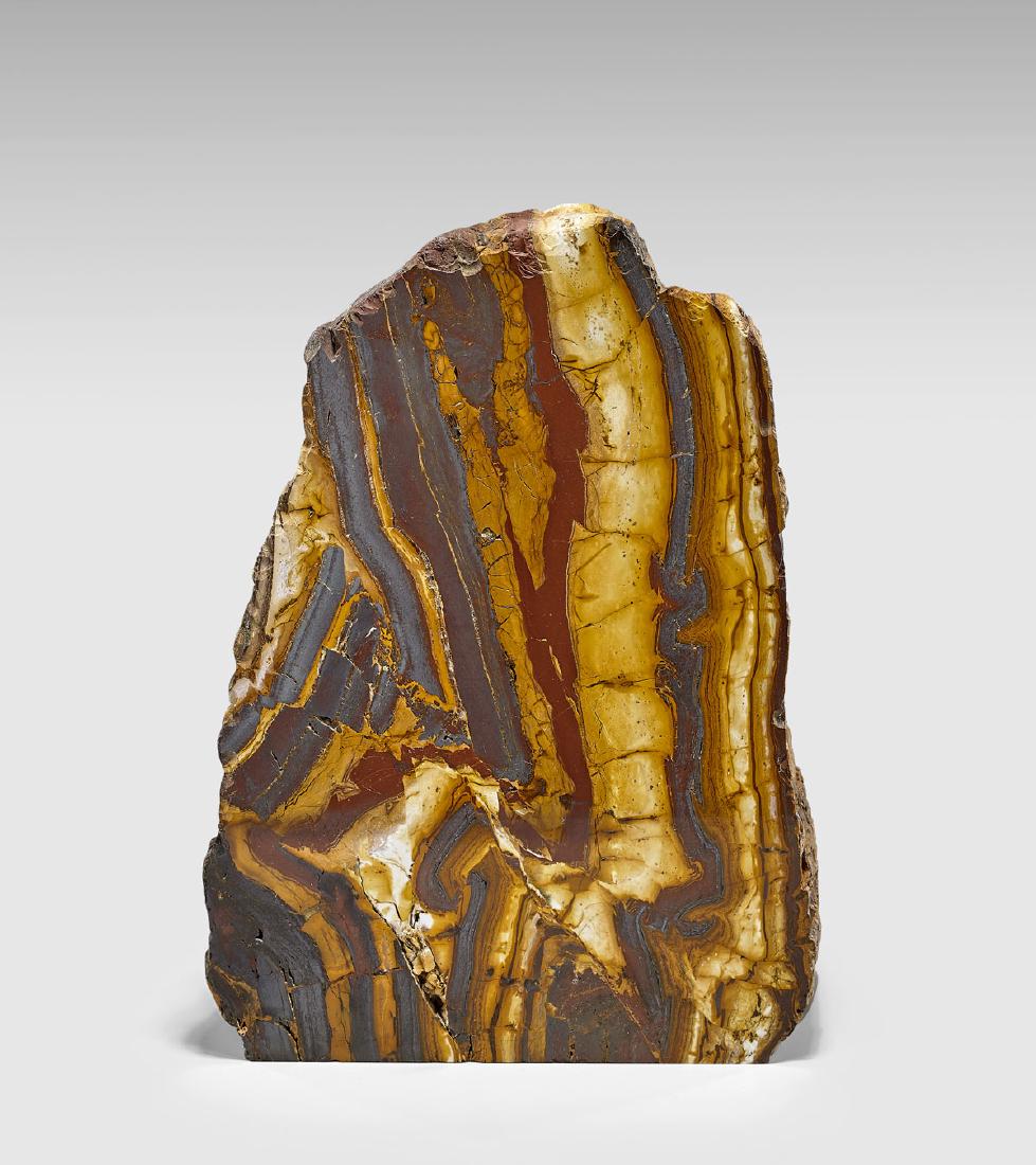 JASPER AND HEMATITE FREEFORM: Australia Millions of years of tectonic activity have compressed layers of rich red jasper and creamy calcite into the fascinating patterning visible on the cut and polished face of this handsome free