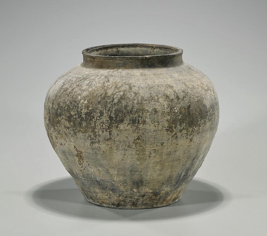 Chinese Han Dynasty Pottery Jar: Chinese Han Dynasty pottery jar; of tapered globular form, with raised rim; showing subtle horizontal markings throughout; Provenance: Collection of Stuart H. Salsbury; D: 12 3/4" (approx.)