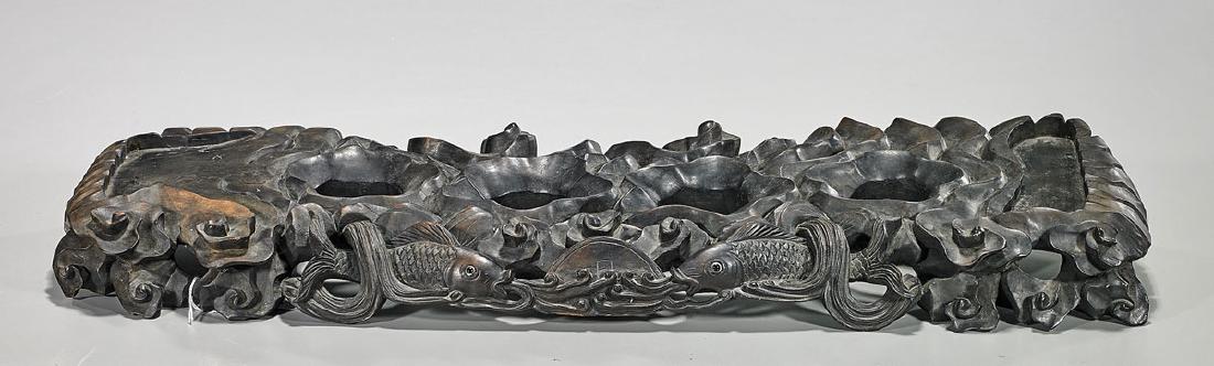 Chinese Carved Hardwood Tea Ceremony Stand: Chinese carved hardwood tea ceremony stand; of rectangular form; exhibiting openwork design of double fish with coin amid stylized clouds; the teacup placeholders of floral form; Provenance: Estate of
