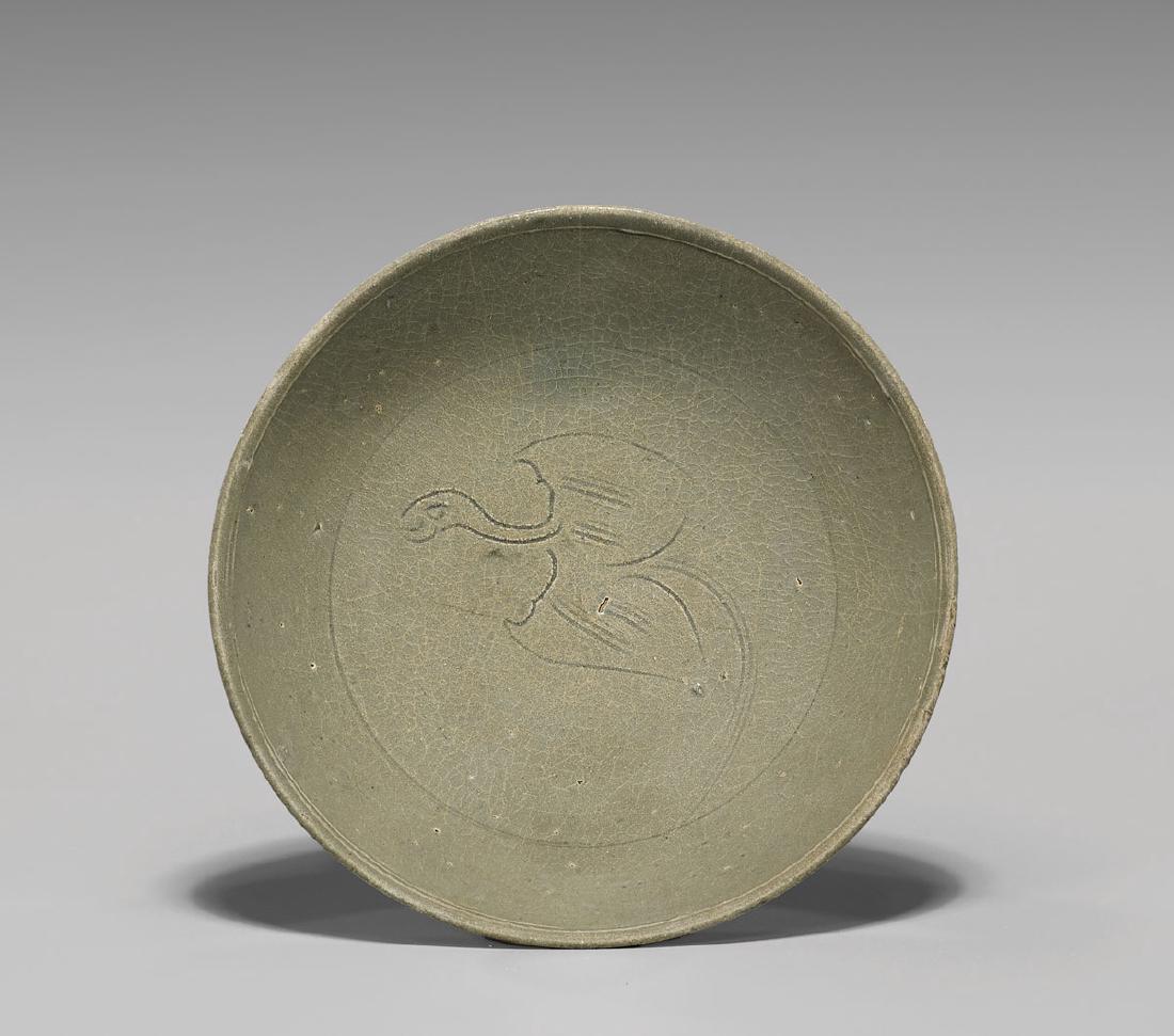 ANTIQUE KOREAN INCISED CELADON BOWL: Antique Korean celadon glazed bowl; finely potted, with incised bird design to interior; Provenance: Collection of B.J. Cheh; D: 6 1/2"