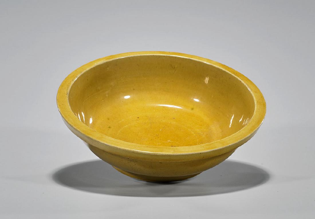 Ming Dynasty Yellow Porcelain Bowl: Antique Chinese Ming Dynasty monochrome yellow porcelain bowl; of shallow circular form with raised foot; Provenance: Estate of Delmer & Roberta Burk; D: 8" (approx.)