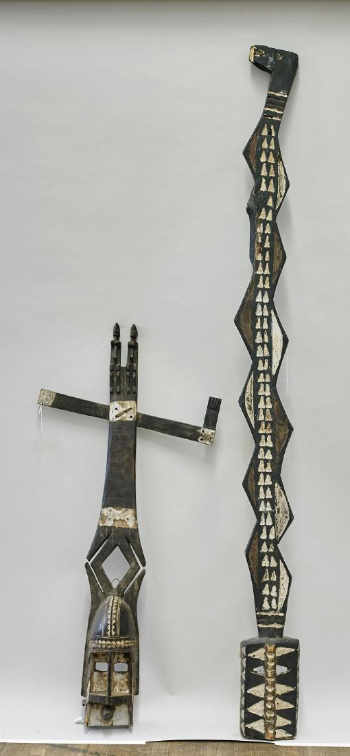 Two Tall African Polychrome Wood Plank Masks: Two tall African polychrome wood plank masks, including: Dogon, Mali kanaga dance mask; together with other, likely of the Mossi, Burkina Faso, with geometric detailing; H: 6' 3 1/2" (tall
