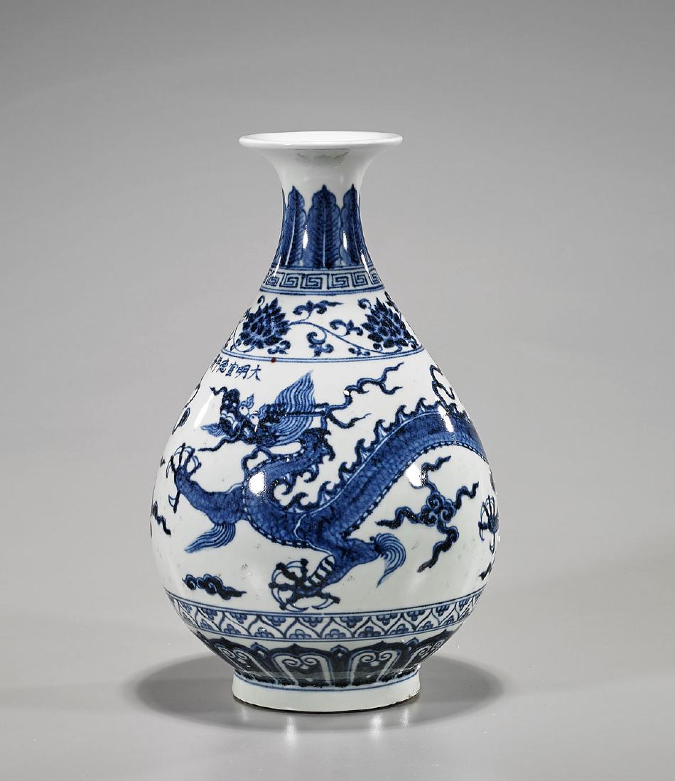 Ming-Style Blue & White Porcelain Vase: Chinese Ming-style blue and white porcelain vase; of yuhuchun form; showing a dragon chasing a flaming pearl amid stylized clouds; with six-character Xuande mark to shoulder; H: 12" (approx.&#