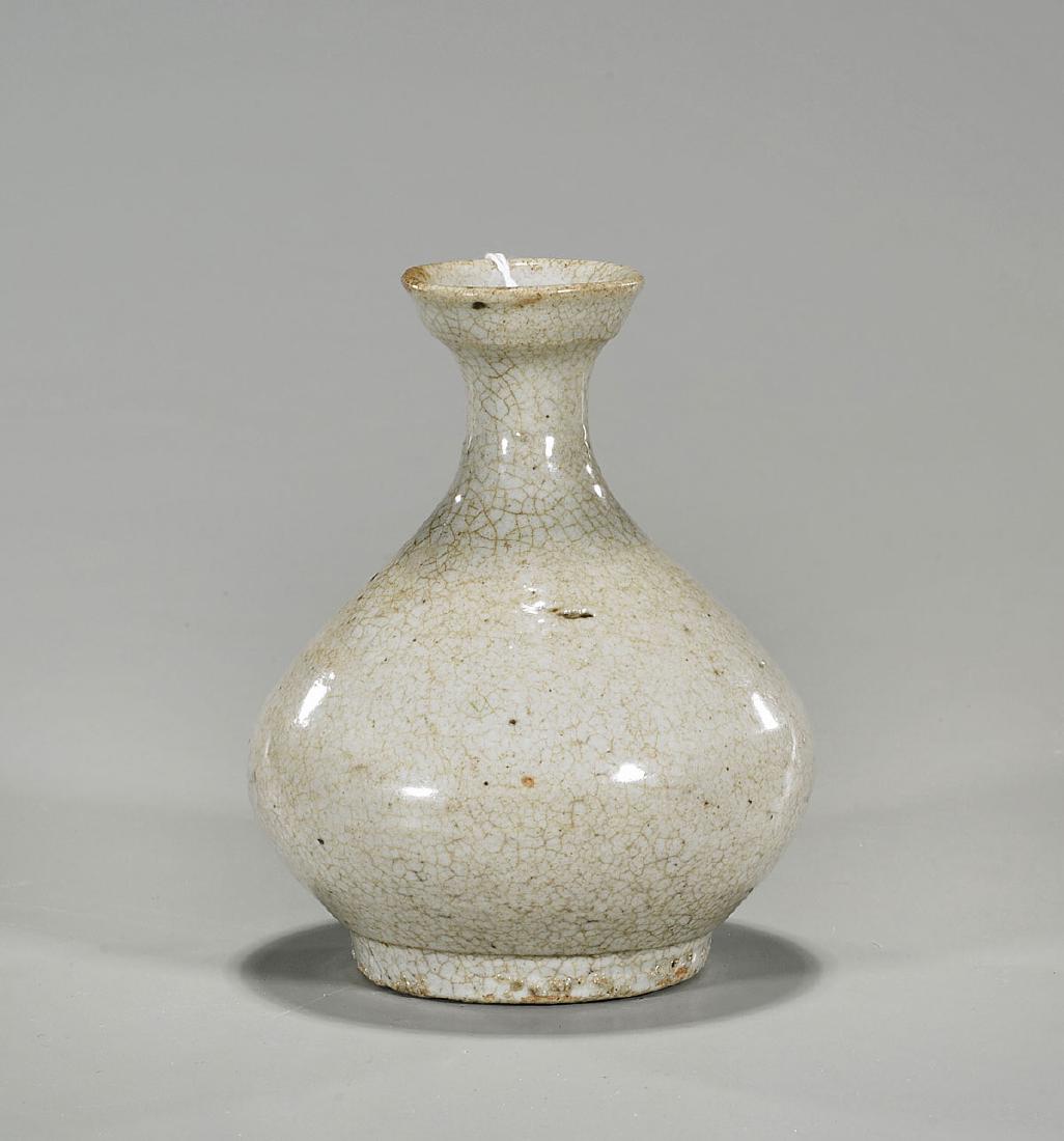 Antique Korean Crackle Glazed Vase: Antique Korean Joseon Dynasty crackle glazed vase; of bulbous bottle form, set on a low foot; with raised rim; Provenance: Collection of Jung Park; H: 4 3/4" (approx.)