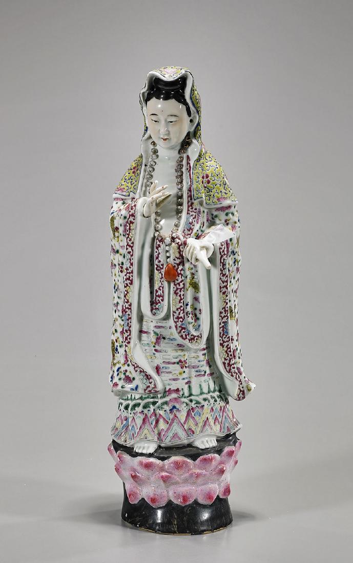 Antique Chinese Enameled Porcelain Figure of Guanyin: Antique Chinese enameled porcelain figure of Guanyin; wearing long, flowing robes and parcel-gilt necklace; her articulated hands gesturing, pouring out her bottle of tears; standing atop a lotus base