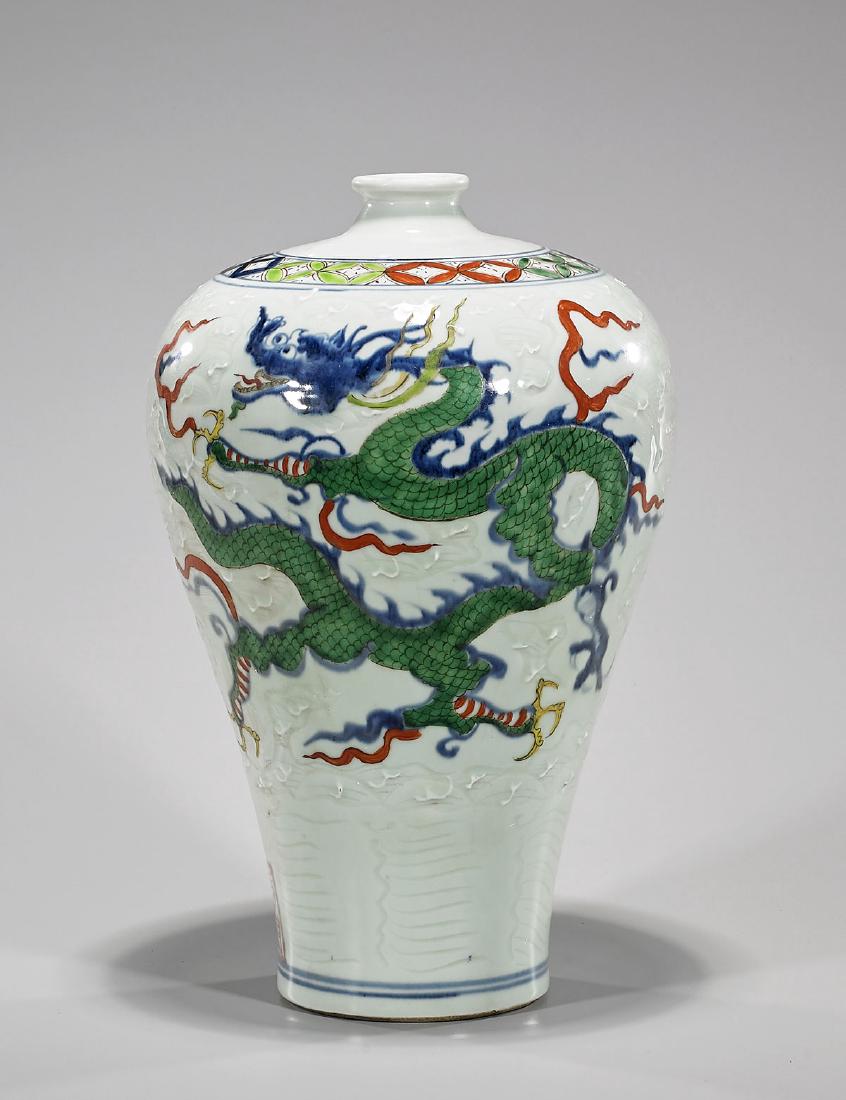 Chinese Celadon, Blue & White Porcelain Meiping Vase: Chinese Ming-style celadon, blue and white porcelain vase; of meiping form; featuring colorful writhing dragons contesting flaming pearl on an incised and raised wave-motif ground; with marks to foot 