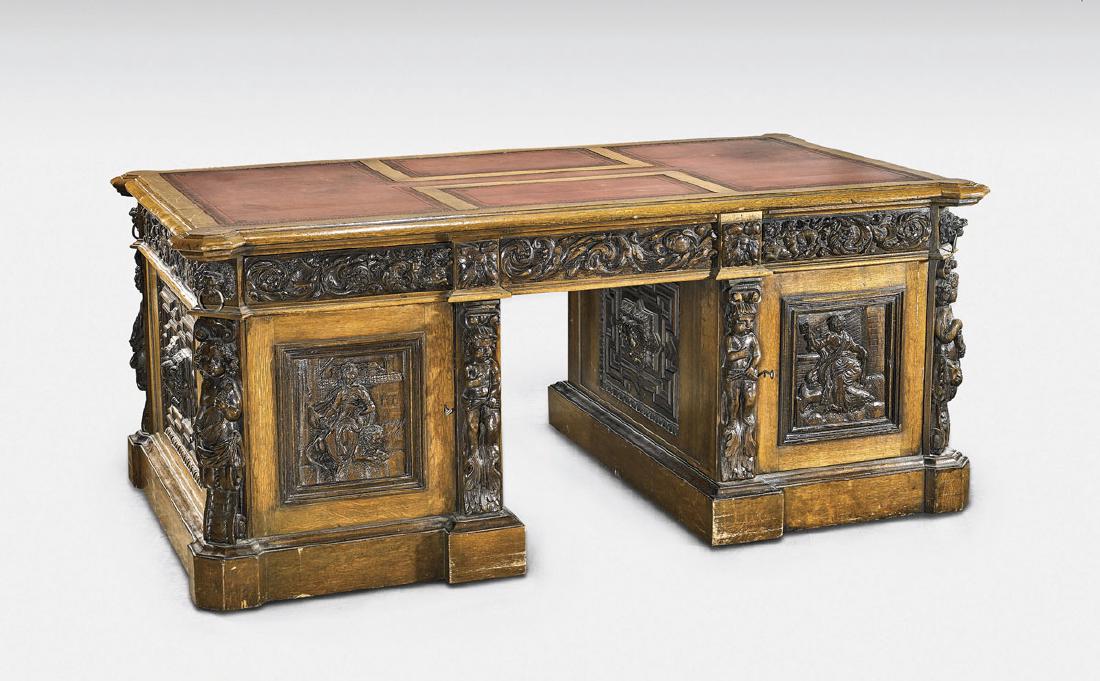ANTIQUE RENAISSANCE REVIVAL WOOD PARTNER'S DESK: Antique Renaissance Revival wood partner's desk; the rectilinear form decorated with heavily carved panelling; showing elaborate figural panels flanked by standing putti and scrolling foliate bord