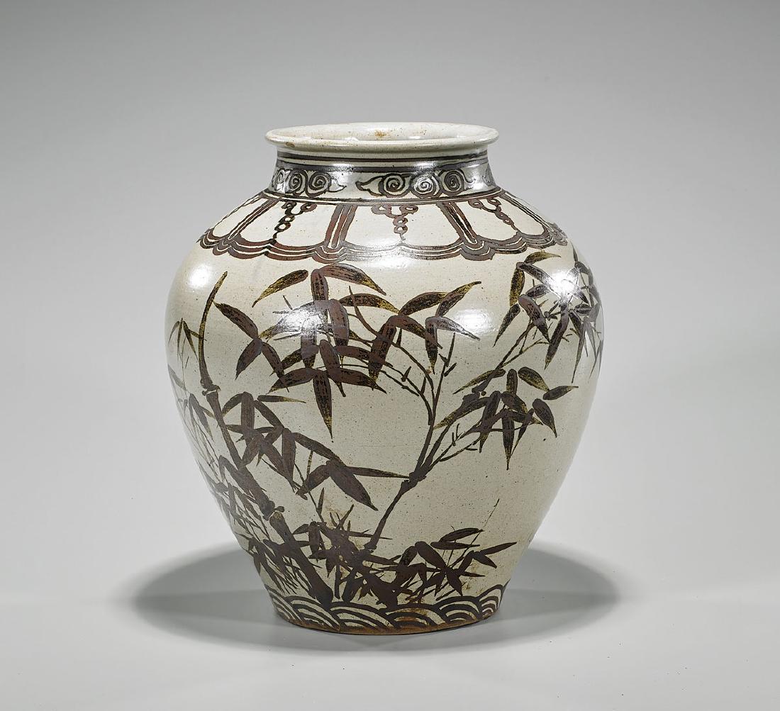 Antique Korean Iron Underglaze Porcelain Jar: Antique Korean Late Joseon Dynasty iron underglaze porcelain jar; of ovoid form, with high shoulders and everted rim; showing various foliate motifs on a beige ground; H: 12 1/2" approx