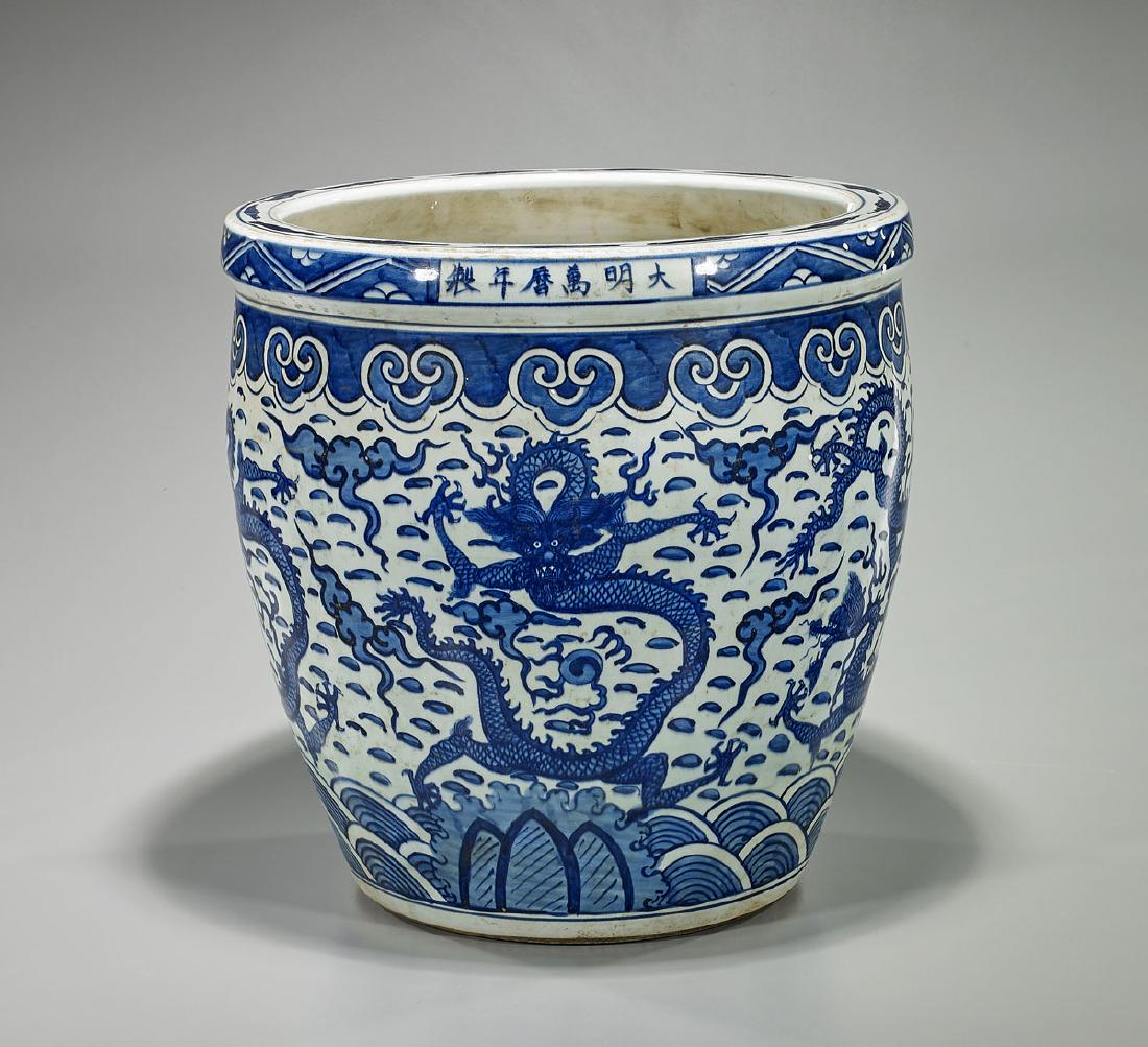 Ming-Style Blue & White Porcelain Fish Bowl: Chinese Ming-style blue and white porcelain fish bowl; of tapered globular form; showing continuous design of dragons chasing flaming pearl amid stylized clouds and flames; six-character mark to rim,
