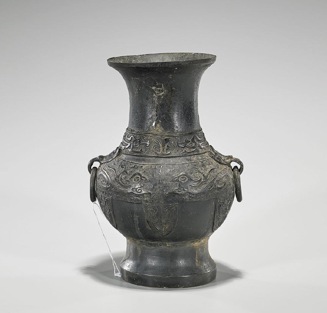 Antique Chinese Bronze Vase: Antique Chinese bronze vase; of globular form, with loop handles pending rings; the body exhibiting archaistic bird designs on a diaper patterned ground; 19th Century; H: 10" (approx.)
