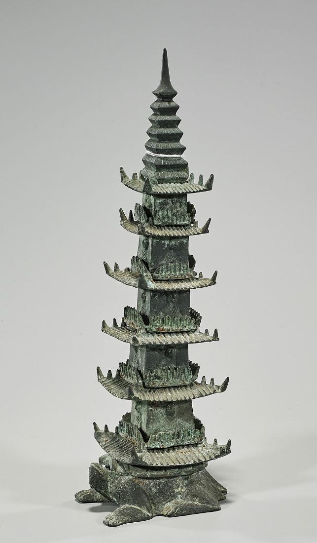Antique Korean Bronze Pagoda: Antique Korean bronze pagoda; the six-tiered temple on a turtle-form base; showing seated worshippers to each side; 19th Century; H: 14 3/4" (approx.)