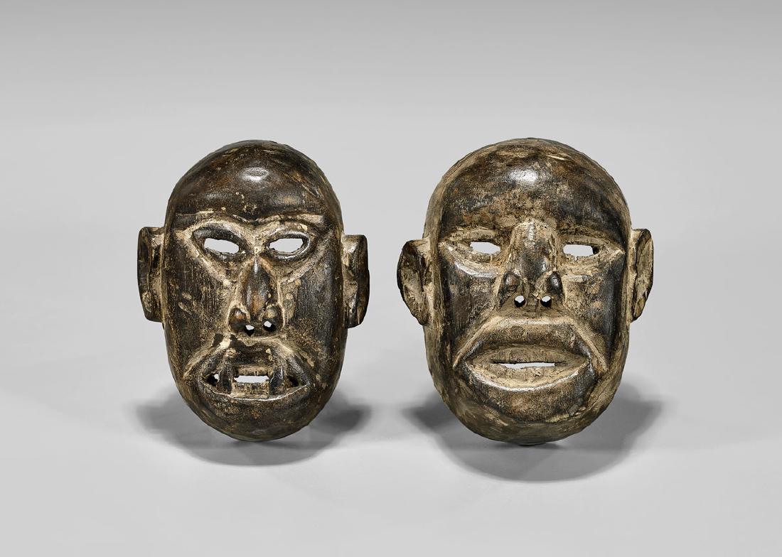 TWO NAGA CARVED WOOD MASKS (1 of 2)