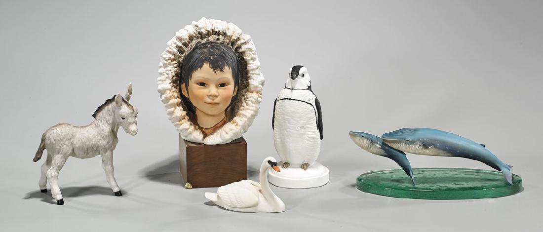 Group of Five Porcelains: Group of five porcelains, including: two Cybis, donkey and boy; Hutschenreuther whale group, with glass stand; Laszlo Ispanky swan; together with penguin by William Kazmar; each signed to base; L: 10
