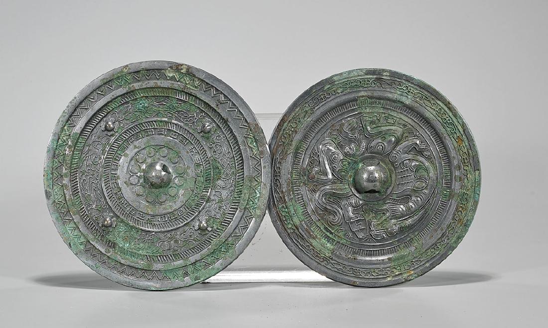Two Archaistic Chinese Bronze Mirrors: Two archaistic Chinese bronze mirrors; Provenance: Private collection, Beverly Hills; D: 8 1/4" (widest, approx.)