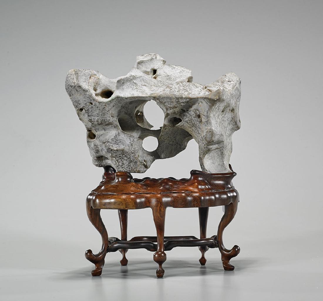 Chinese Scholar's Rock: Chinese scholar's rock; Provenance: Collection of Jack & Sheila Clarke; L: 7 1/2" (approx.); wood stand