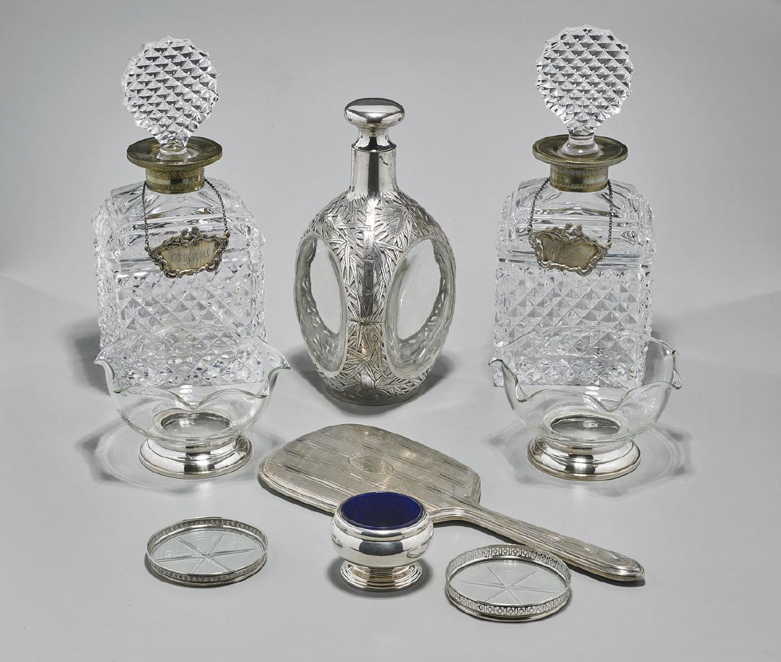 Group of Nine Sterling Silver-Mounted Glass Pieces: Group of nine sterling silver-mounted glass pieces: Gorham hand mirror, stamped STERLING; pair of floriform bowls by Web, stamped STERLING; pair of decanters, stamped 800; bamboo-motif decanter, stamp