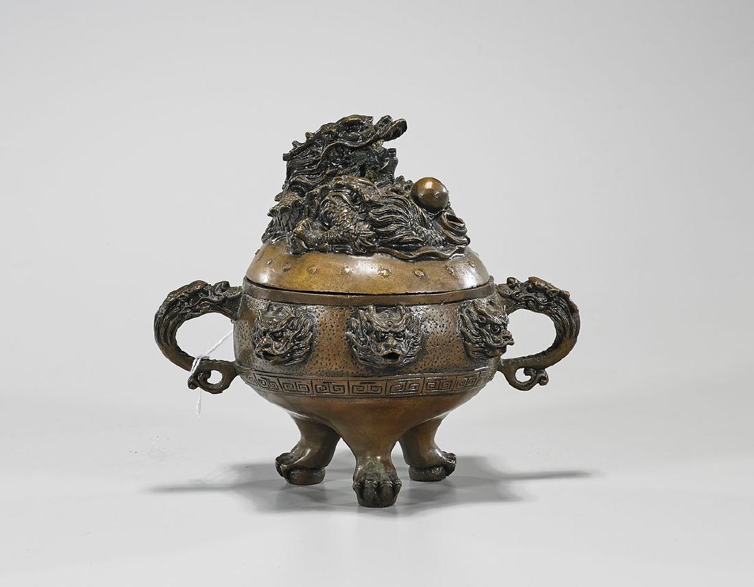 Chinese Bronze Covered Tripod Censer: Chinese bronze covered tripod 'dragon' censer; L: 7 1/2" (approx.)