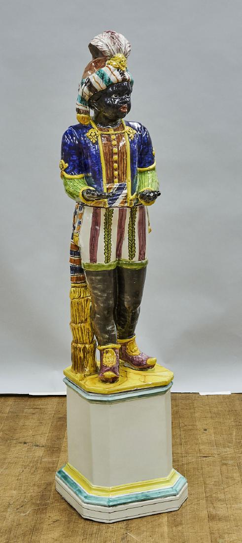 Tall Sectional Glazed Ceramic Blackamoor: Tall sectional glazed ceramic blackamoor; standing atop a faceted base; Provenance: Estate of Rafael de Marchena-Huyke; H: 53" (approx.)