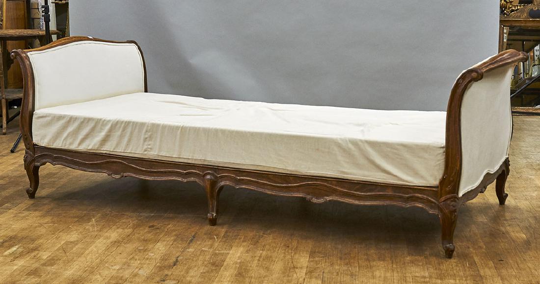 Pair Carved Wood Daybeds: Pair of carved wood and upholstered daybeds; Provenance: Estate of Rafael de Marchena-Huyke; 28" x 86" x 35" (each, approx.)