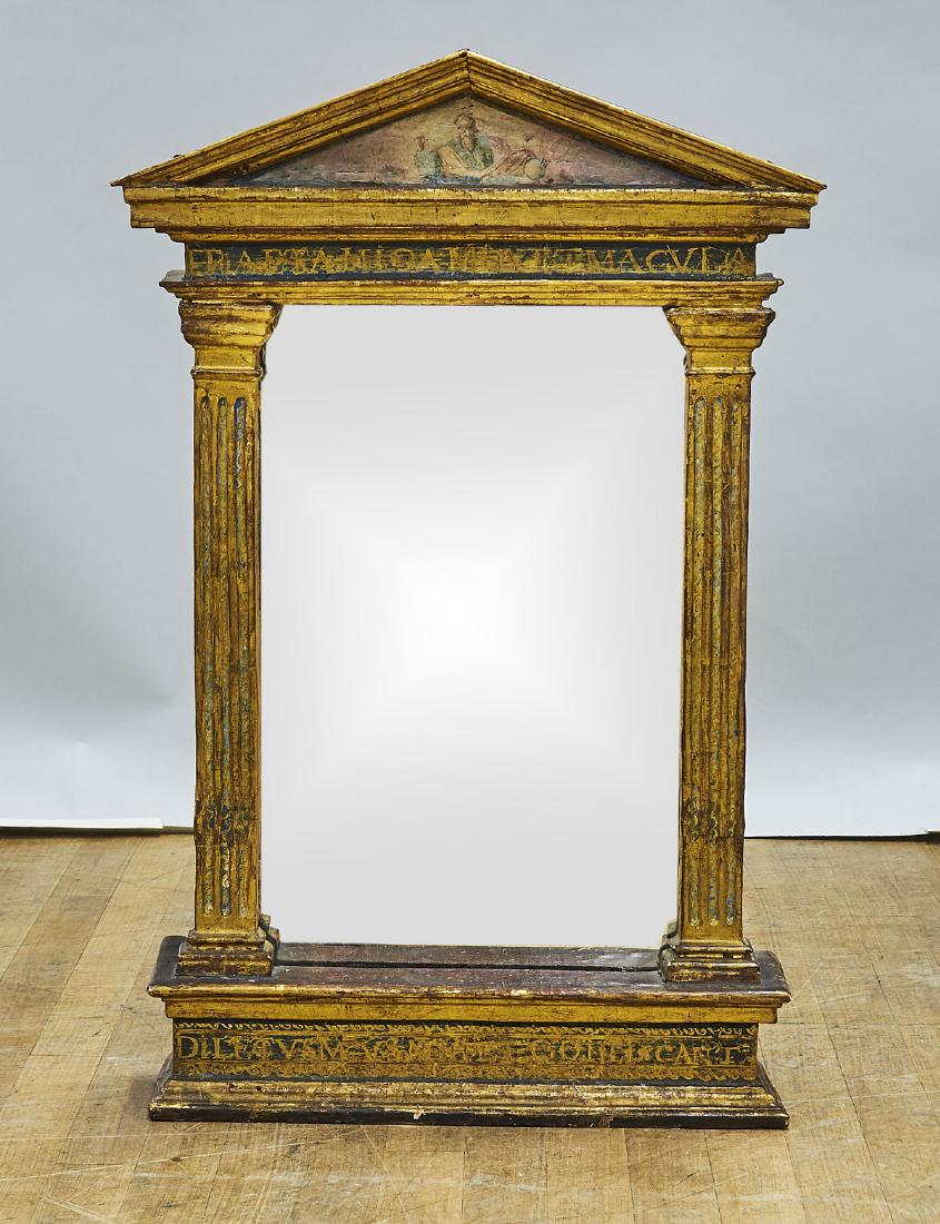 Antique Continental Gilt & Painted Wood Mirror: Antique Continental gilt and painted wood mirror; the frame of architectural form; the pediment depicting a bearded figure holding an orb; with words in Latin written within the frieze below and doric