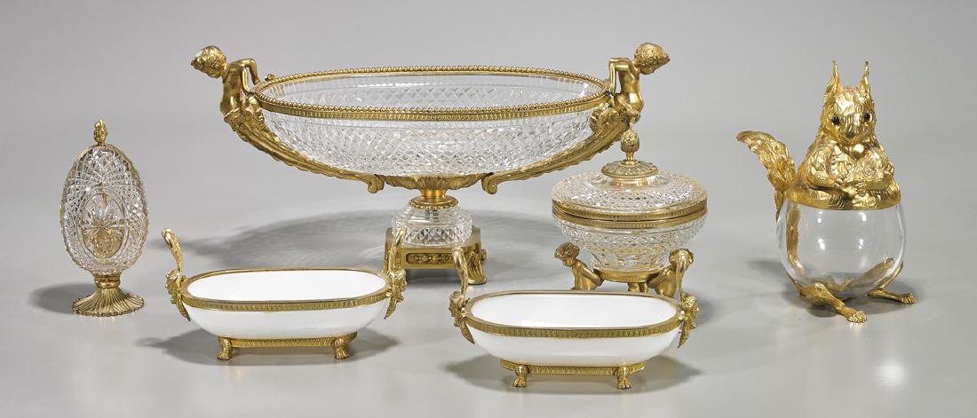 Group of Six Ormolu-Mounted Glass Pieces: Group of six ormolu-mounted glass pieces, including: squirrel-form jar; egg-form perfumer bottle; pair of bowls; large vessel; together with figural tripod covered vessel; Provenance: Estate of Rafael