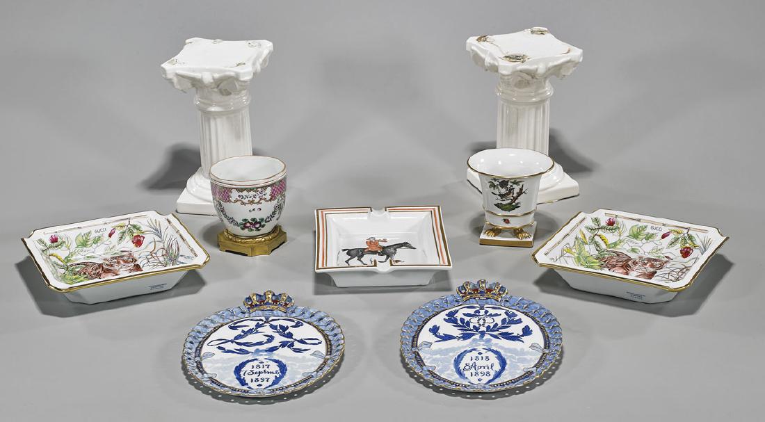 Group of Nine Various Porcelains: Group of nine various porcelains: pair Bernardaud Limoges ashtray reading Gucci to top; ashtray, reading Hermes France; Herend vessel; metal mounted vessel; pair of plaques; together with a pair of pe