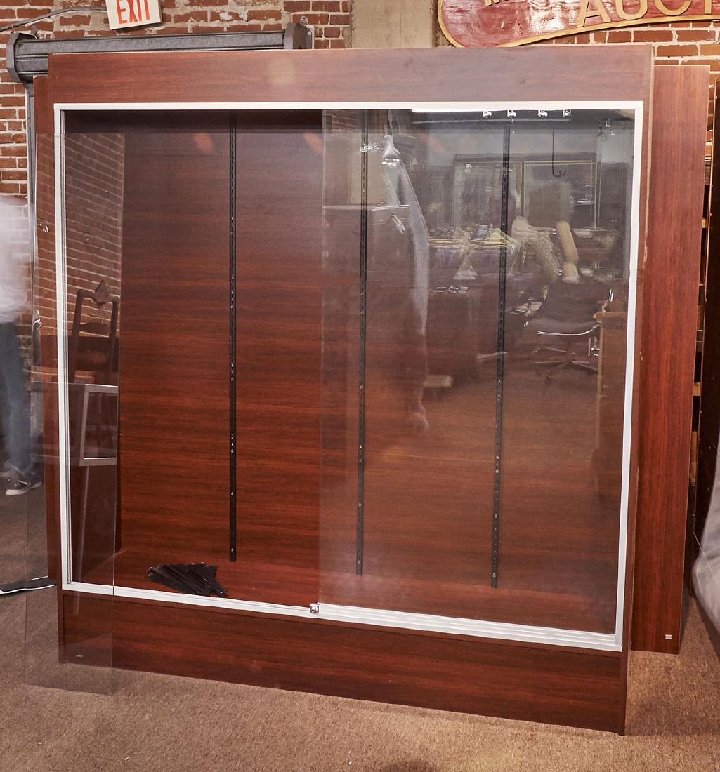 Large Display Cabinet: Large display cabinet; comprising sliding glass doors, with multiple glass shelving units and battery operated LED lighting; 78" x 72" x 18" (approx.)