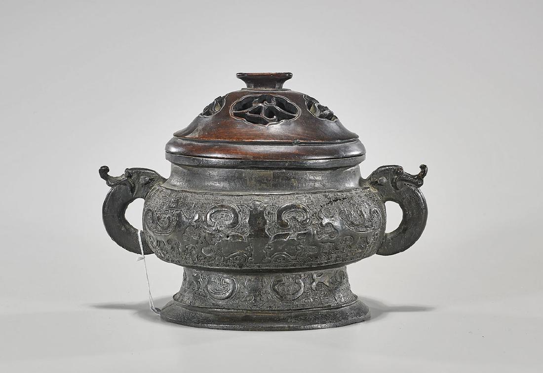 Archaistic Chinese Bronze Censer: Archaistic Chinese bronze censer; with wood cover; early 20th Century; L: 11" (approx.)