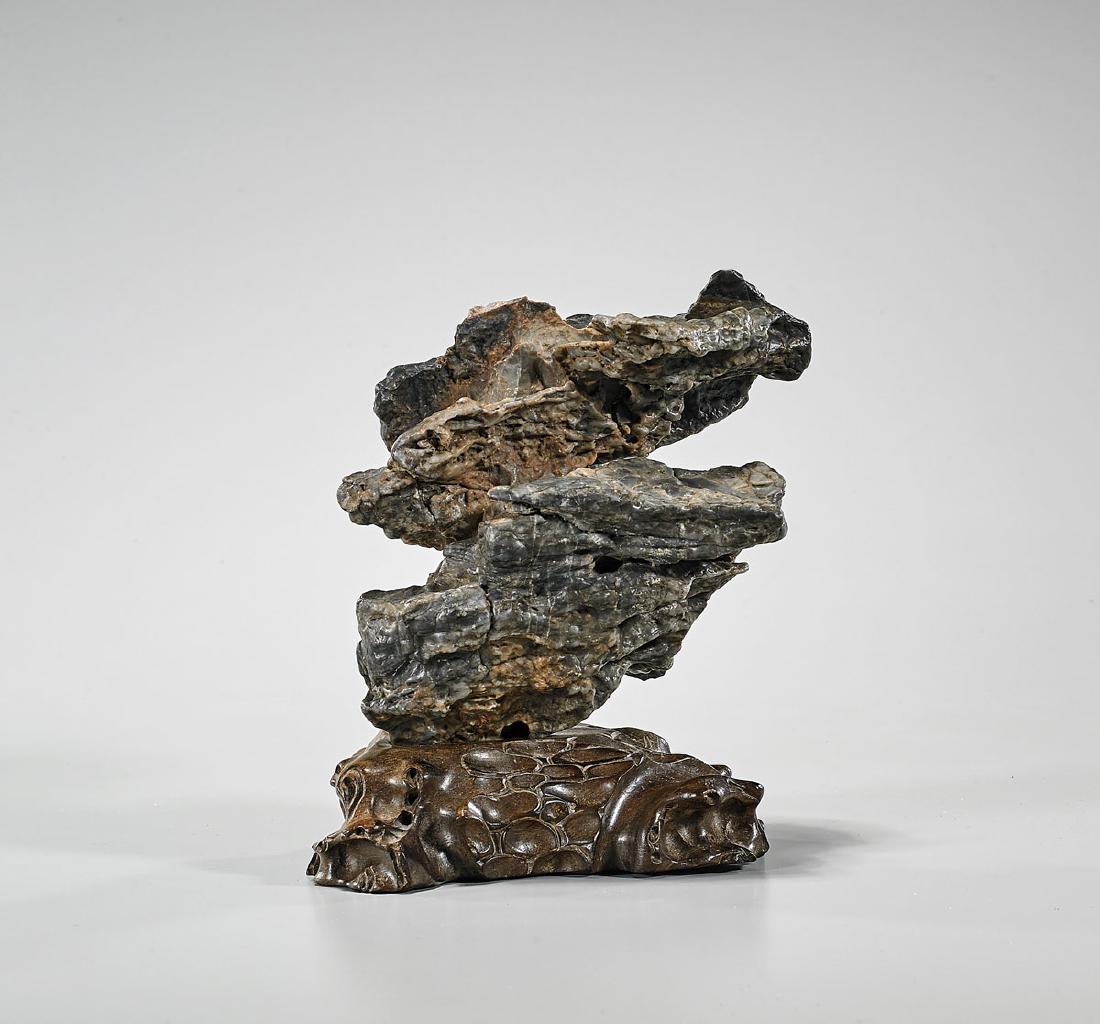 Chinese Scholar's Rock: Chinese scholar's rock; Provenance: Collection of Jack & Sheila Clarke; H: 5" (approx.); wood stand
