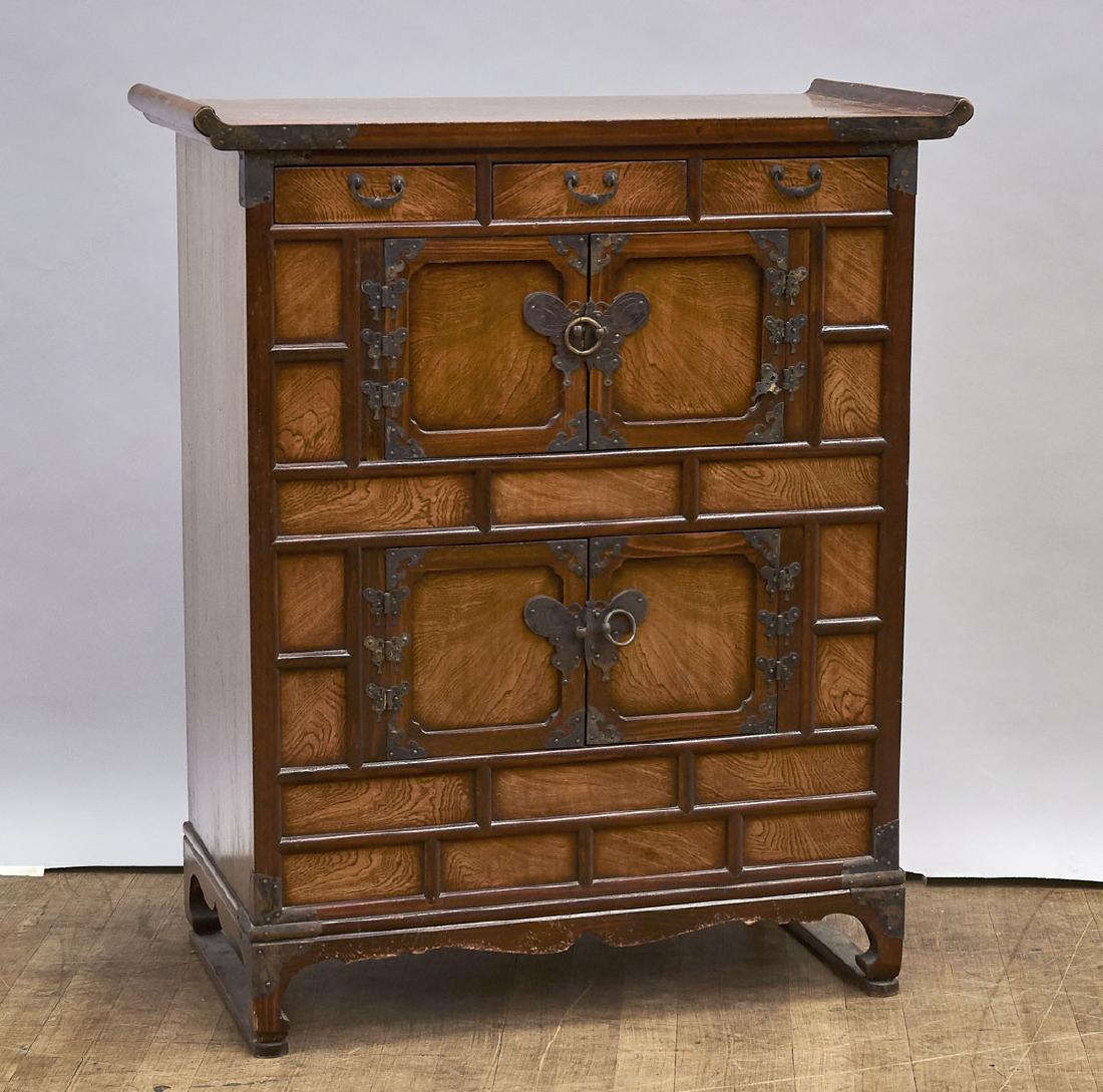Korean Wood Cabinet: Korean wood cabinet; comprising two double doors, set below three drawers; with metal butterfly-motif accents; 37" x 30 1/2" x 15 1/2" (approx.)