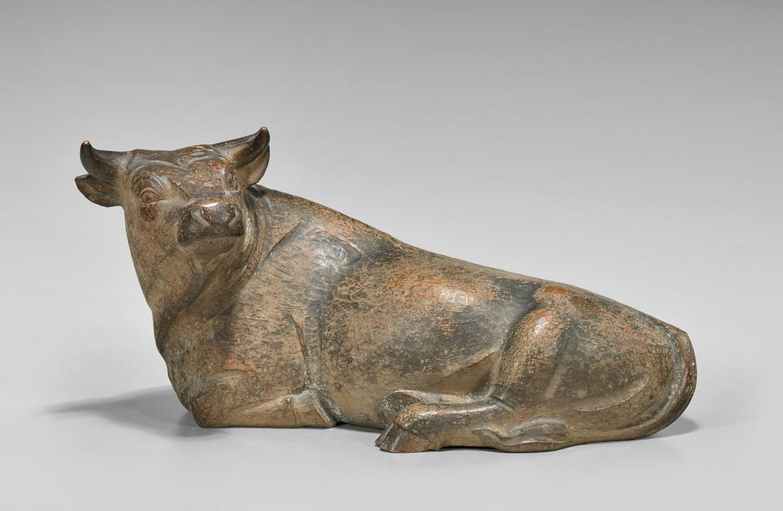 JAPANESE CARVED WOOD OX: Japanese carved wood model of a recumbent ox; signed; L: 14" (approx.); with wood box