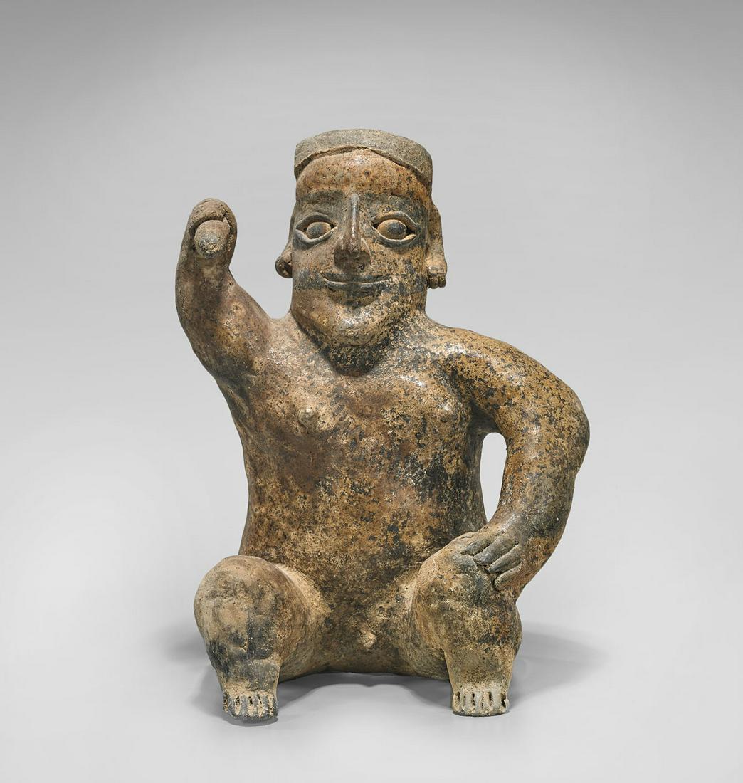 JALISCO SEATED MALE FIGURE: Pre-Columbian Jalisco seated male figure; the well-sculpted features accented by dark slip; circa 200 B.C.-400 A.D.; Provenance: Collection of Dr. Donald Feigelson; with appraisal by Sidney Newman, Et