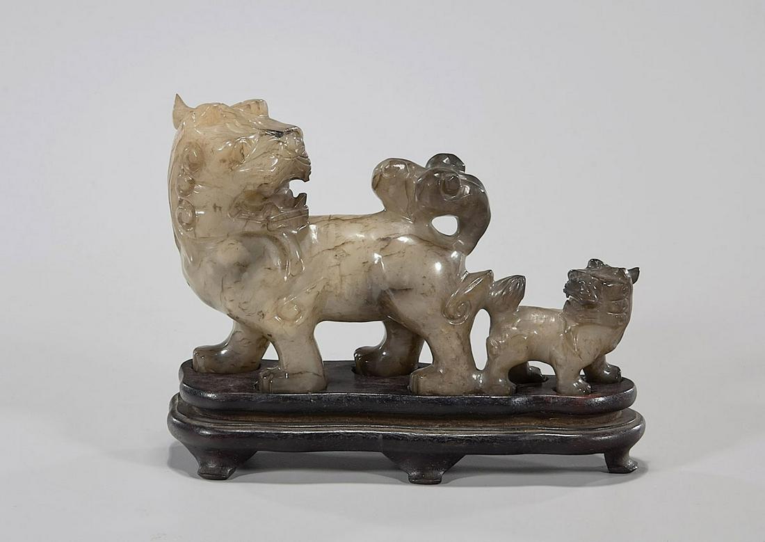 Antique Chinese Carved Jade Lion With Cub: Antique Chinese carved jade lion with cub; with wood stand; Provenance: the Estate of Ted Adameck; L: 6 1/2"
