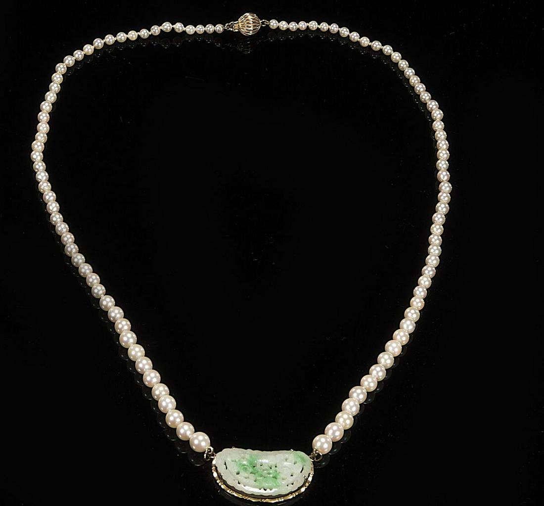 Jadeite Gold Pendant on Pearl Necklace: Antique Chinese modeled green & white openwork carved jadeite pendant mounted in 14 kt yellow gold, strung on graduated pearl necklace with 14 kt yellow gold clasps; L: 20" (approx.) D: 6.35mm (larges