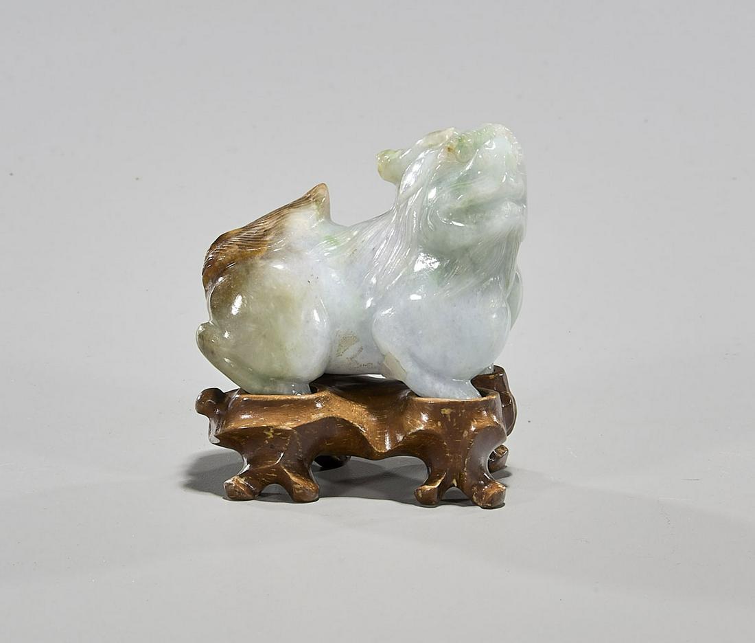 Chinese Carved Jadeite Lion: Chinese carved jadeite lion; wood stand; L:3"(approx.)