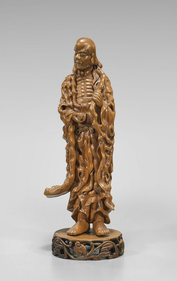 Carved Wood Figure of a Lohan: Chinese carved wood standing figure of a Lohan; mounted to wood stand; Provenance: the Estate of Ted Adameck; H: 13 1/4" (approx.)