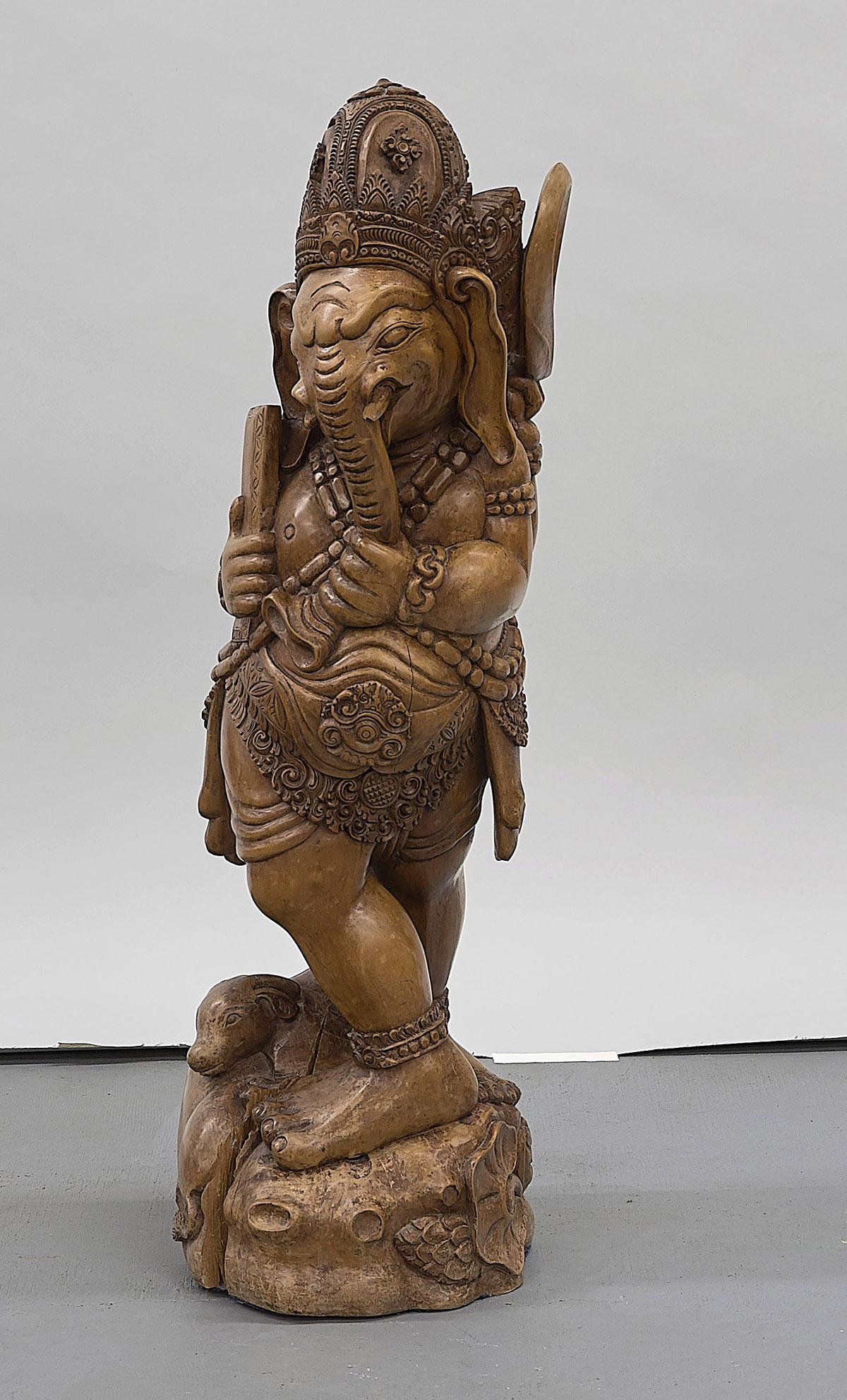 Tall Carved Indonesian Figure of Ganesha: Tall carved Indonesian figure of Ganesha; H: 31"; Due to COVID-19 restrictions, our employees are working remotely. It may not be possible to provide condition reports and additional photos for this l