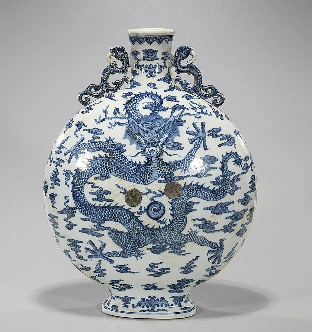 Chinese Blue & White Porcelain Moonflask: Chinese blue & white porcelain moonflask; with dragon motif; H: 20"; Due to COVID-19 restrictions, our employees are working remotely. It may not be possible to provide condition reports and additiona